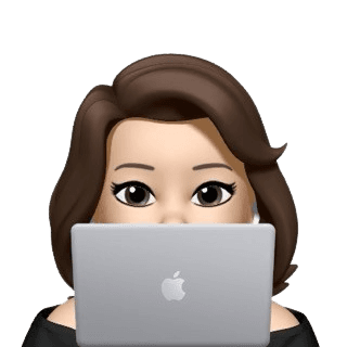 Person peeking from behind laptop